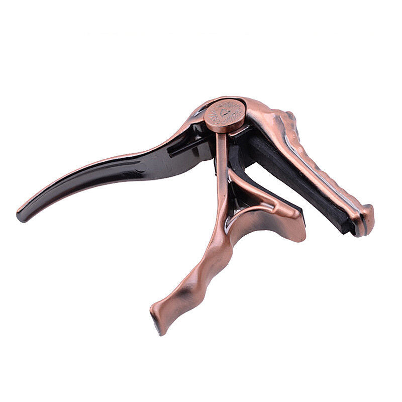 CAPO P/ GUITARRA CON FORMA DE COCODRILO COLOR BRONCE PURPURA A007G/PB N