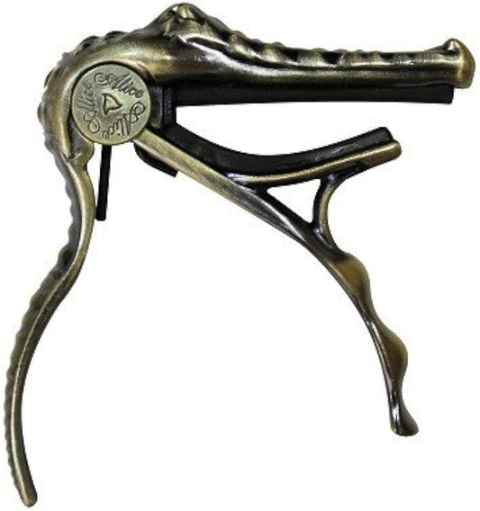 CAPO P/ GUITARRA CON FORMA DE COCODRILO COLOR BRONCE A007G/BR N